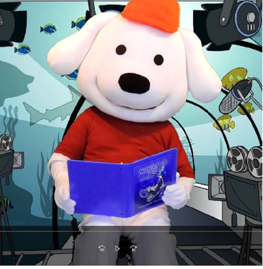 Storytime Pup reading a book